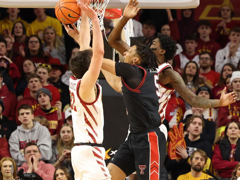 Feb 17, 2024; Ames, Iowa, USA; Texas Tech Red Raiders guard Darrion Williams (5) drives to the basket against Iowa State Cyclones forward Milan Momcilovic (22) and forward Hason Ward (24) during the second half at James H. Hilton Coliseum. Mandatory Credit: Reese Strickland-USA TODAY Sports