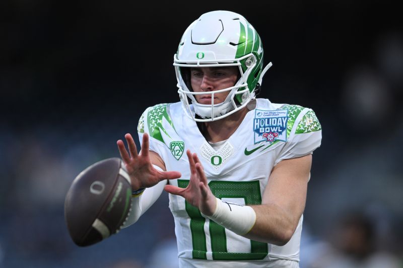 Dec 28, 2022; San Diego, CA, USA; Oregon Ducks quarterback Bo Nix (10) warms up before the 2022 Holiday Bowl against the North Carolina Tar Heels at Petco Park. Mandatory Credit: Orlando Ramirez-USA TODAY Sports