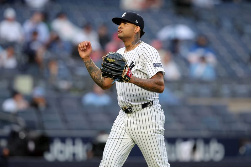 Aug 7, 2024; Bronx, New York, USA; New York Yankees starting pitcher Luis Gil (81) reacts during the fifth inning against the Los Angeles Angels at Yankee Stadium. Mandatory Credit: Brad Penner-USA TODAY Sports