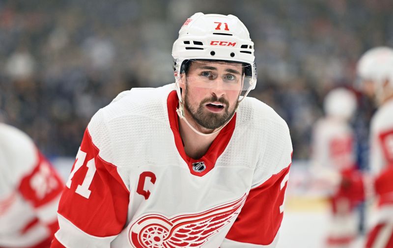 Jan 14, 2024; Toronto, Ontario, CAN;  Detroit Red Wings forward Dylan Larkin (71) prepares to take a faceoff against the Toronto Maple Leafs in the second period at Scotiabank Arena. Mandatory Credit: Dan Hamilton-USA TODAY Sports