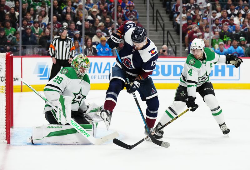 Apr 7, 2024; Denver, Colorado, USA; Dallas Stars goaltender Jake Oettinger (29) and defenseman Miro Heiskanen (4) defend on Colorado Avalanche right wing Valeri Nichushkin (13) in the second period at Ball Arena. Mandatory Credit: Ron Chenoy-USA TODAY Sports