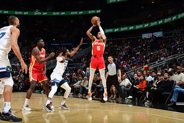 ATLANTA, GA - OCTOBER 30: Dejounte Murray #5 of the Atlanta Hawks shoots a three point basket against the Minnesota Timberwolves on October 30, 2023 at State Farm Arena in Atlanta, Georgia.  NOTE TO USER: User expressly acknowledges and agrees that, by downloading and/or using this Photograph, user is consenting to the terms and conditions of the Getty Images License Agreement. Mandatory Copyright Notice: Copyright 2023 NBAE (Photo by Scott Cunningham/NBAE via Getty Images)