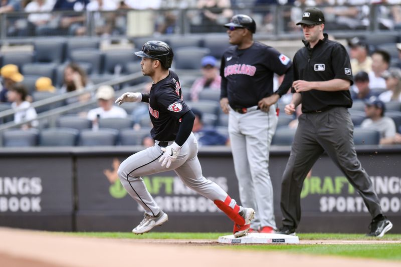 Aug 22, 2024; Bronx, New York, USA; Cleveland Guardians outfielder Steven Kwan (38) rounds first base after hitting a single against the New York Yankees during the first inning at Yankee Stadium. Mandatory Credit: John Jones-USA TODAY Sports