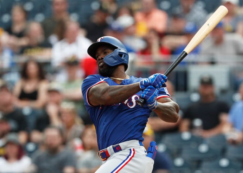 May 23, 2023; Pittsburgh, Pennsylvania, USA; Texas Rangers right fielder Adolis Garcia (53) hits a double against the Pittsburgh Pirates during the third inning at PNC Park. Mandatory Credit: Charles LeClaire-USA TODAY Sports