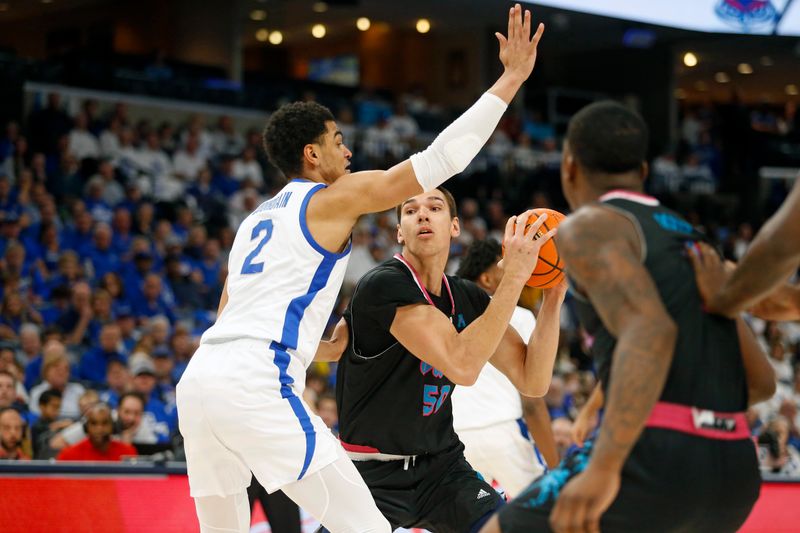 Feb 25, 2024; Memphis, Tennessee, USA; Florida Atlantic Owls center Vladislav Goldin (50) handles the ball as Memphis Tigers forward Nicholas Jourdain (2) defends during the second half at FedExForum. Mandatory Credit: Petre Thomas-USA TODAY Sports