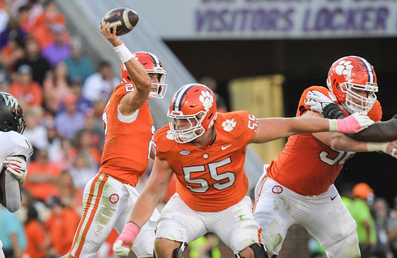 Oct 7, 2023; Clemson, South Carolina, USA; Clemson Tigers quarterback Cade Klubnik (2) throws with blocking by offensive lineman Harris Sewell (55) and offensive lineman Will Putnam (56) against the Wake Forest Demon Deacons during the fourth quarter at Memorial Stadium. Mandatory Credit: Ken Ruinard-USA TODAY Sports