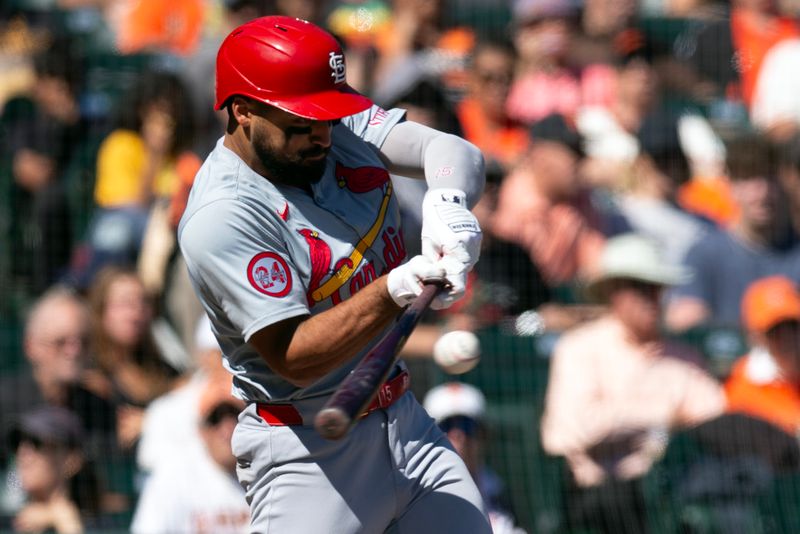 Sep 29, 2024; San Francisco, California, USA; St. Louis Cardinals third baseman Jose Fermin (15) hits an RBI single against the San Francisco Giants during the sixth inning at Oracle Park. Mandatory Credit: D. Ross Cameron-Imagn Images