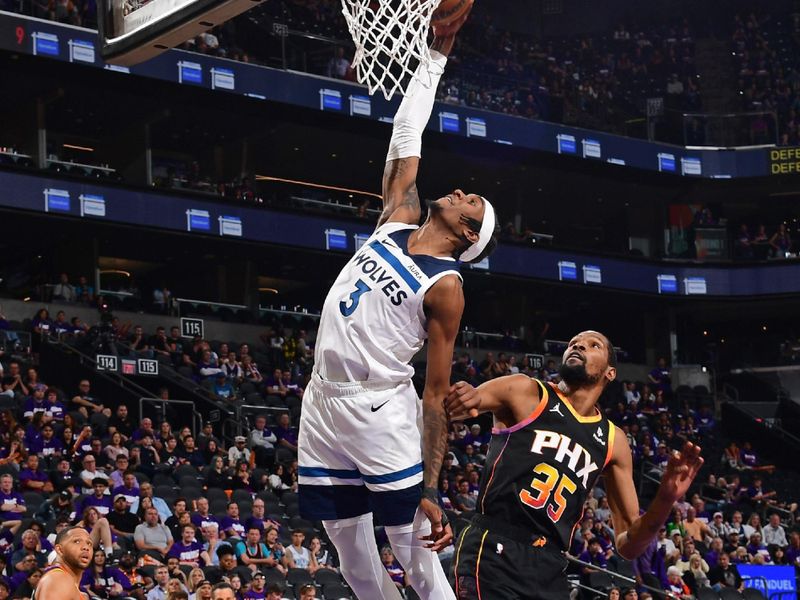 PHOENIX, AZ - APRIL  26: Jaden McDaniels #3 of the Minnesota Timberwolves drives to the basket during the game against the Phoenix Suns on April 26, 2024 at Footprint Center in Phoenix, Arizona. NOTE TO USER: User expressly acknowledges and agrees that, by downloading and or using this photograph, user is consenting to the terms and conditions of the Getty Images License Agreement. Mandatory Copyright Notice: Copyright 2024 NBAE (Photo by Kate Frese/NBAE via Getty Images)