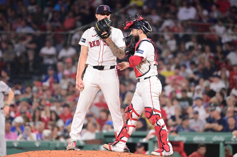 Jul 28, 2024; Boston, Massachusetts, USA; Boston Red Sox starting pitcher Tanner Houck (89) and catcher Connor Wong (12) have a meeting during the fifth inning against the New York Yankees at Fenway Park. Mandatory Credit: Eric Canha-USA TODAY Sports