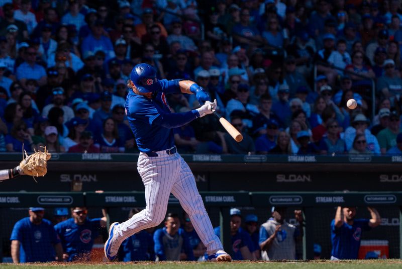 Mar 9, 2024; Mesa, Arizona, USA; Chicago Cubs infielder Nico Hoerner (2) bats against the Colorado Rockies in the fourth inning during a spring training game at Sloan Park. Mandatory Credit: Allan Henry-USA TODAY Sports