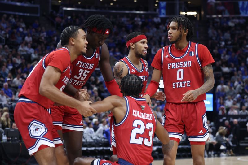 Dec 1, 2023; Salt Lake City, Utah, USA; Fresno State Bulldogs guard Leo Colimerio (23) is helped out by teammates after a foul by Brigham Young Cougars during the second half at Delta Center. Mandatory Credit: Rob Gray-USA TODAY Sports