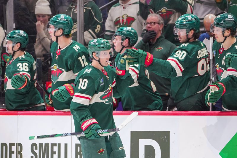 Apr 2, 2024; Saint Paul, Minnesota, USA; Minnesota Wild center Vinni Lettieri (10) celebrates his goal against the Ottawa Senators in the third period at Xcel Energy Center. Mandatory Credit: Brad Rempel-USA TODAY Sports