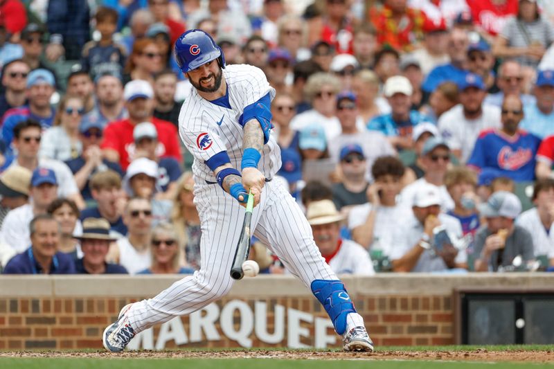 Jul 4, 2024; Chicago, Illinois, USA; Chicago Cubs catcher Tomás Nido (6)hits an RBI-ground out against the Philadelphia Phillies during the fourth inning at Wrigley Field. Mandatory Credit: Kamil Krzaczynski-USA TODAY Sports