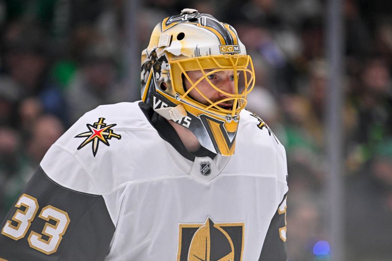 Jan 24, 2025; Dallas, Texas, USA; Vegas Golden Knights goaltender Adin Hill (33) faces the Dallas Stars attack during the second period at the American Airlines Center. Mandatory Credit: Jerome Miron-Imagn Images