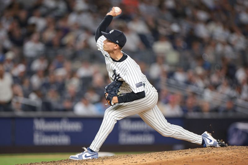 Jun 18, 2024; Bronx, New York, USA; New York Yankees relief pitcher Luke Weaver (30) delivers a pitch during the eighth inning against the Baltimore Orioles at Yankee Stadium. Mandatory Credit: Vincent Carchietta-USA TODAY Sports