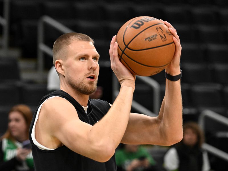 BOSTON, MASSACHUSETTS - JANUARY 30: Kristaps Porzingis #8 of the Boston Celtics warms up before a game against the Indiana Pacers at the TD Garden on January 30, 2024 in Boston, Massachusetts. NOTE TO USER: User expressly acknowledges and agrees that, by downloading and or using this photograph, User is consenting to the terms and conditions of the Getty Images License Agreement. (Photo by Brian Fluharty/Getty Images)