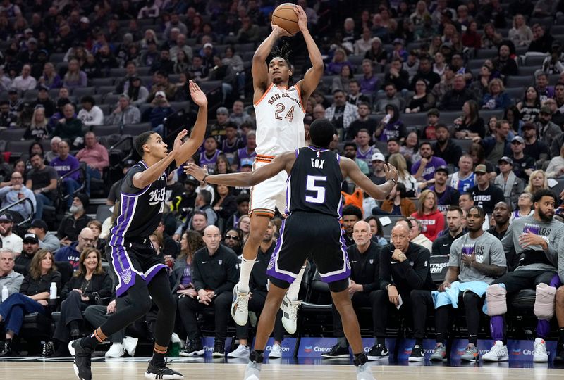 SACRAMENTO, CALIFORNIA - MARCH 07: Devin Vassell #24 of the San Antonio Spurs shoots over De'Aaron Fox #5 and Keegan Murray #13 of the Sacramento Kings during the first half at Golden 1 Center on March 07, 2024 in Sacramento, California. NOTE TO USER: User expressly acknowledges and agrees that, by downloading and or using this photograph, User is consenting to the terms and conditions of the Getty Images License Agreement. (Photo by Thearon W. Henderson/Getty Images)