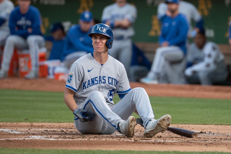 Aug 22, 2023; Oakland, California, USA; Kansas City Royals first baseman Matt Duffy (15) sits down at home plate after avoiding a pitch during the second inningagainst the Oakland Athletics at Oakland-Alameda County Coliseum. Mandatory Credit: Ed Szczepanski-USA TODAY Sports