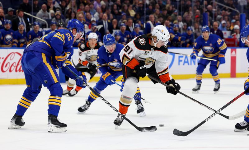 Feb 19, 2024; Buffalo, New York, USA;  Buffalo Sabres defenseman Rasmus Dahlin (26) knocks the puck away from Anaheim Ducks center Leo Carlsson (91) during the first period at KeyBank Center. Mandatory Credit: Timothy T. Ludwig-USA TODAY Sports