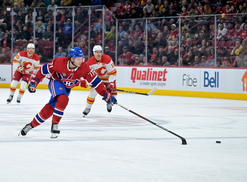 Nov 14, 2023; Montreal, Quebec, CAN; Montreal Canadiens forward Jake Evans (71) chases the puck during the first period of the game against the Calgary Flames at the Bell Centre. Mandatory Credit: Eric Bolte-USA TODAY Sports