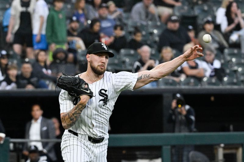 Jun 7, 2024; Chicago, Illinois, USA;  Chicago White Sox pitcher Garrett Crochet (45) commits a throwing error to first base against the Boston Red Sox during the third inning at Guaranteed Rate Field. Mandatory Credit: Matt Marton-USA TODAY Sports