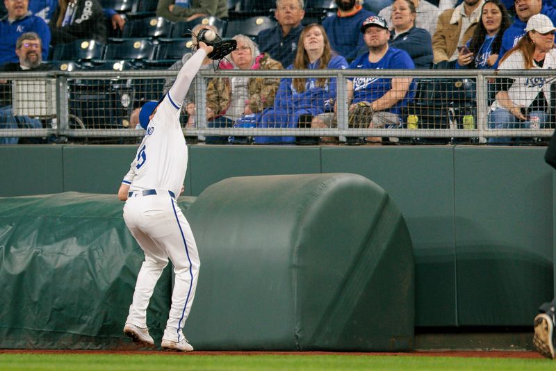 Apr 10, 2024; Kansas City, Missouri, USA; Kansas City Royals first base Vinnie Pasquantino (9) grabs a pop fly in front of fans during the eighth inning against the Houston Astros at Kauffman Stadium. Mandatory Credit: William Purnell-USA TODAY Sports