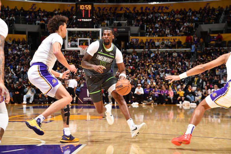 LOS ANGELES, CA - APRIL 7: Naz Reid #11 of the Minnesota Timberwolves dribbles the ball during the game against the Los Angeles Lakers on April 7, 2024 at Crypto.Com Arena in Los Angeles, California. NOTE TO USER: User expressly acknowledges and agrees that, by downloading and/or using this Photograph, user is consenting to the terms and conditions of the Getty Images License Agreement. Mandatory Copyright Notice: Copyright 2024 NBAE (Photo by Juan Ocampo/NBAE via Getty Images)