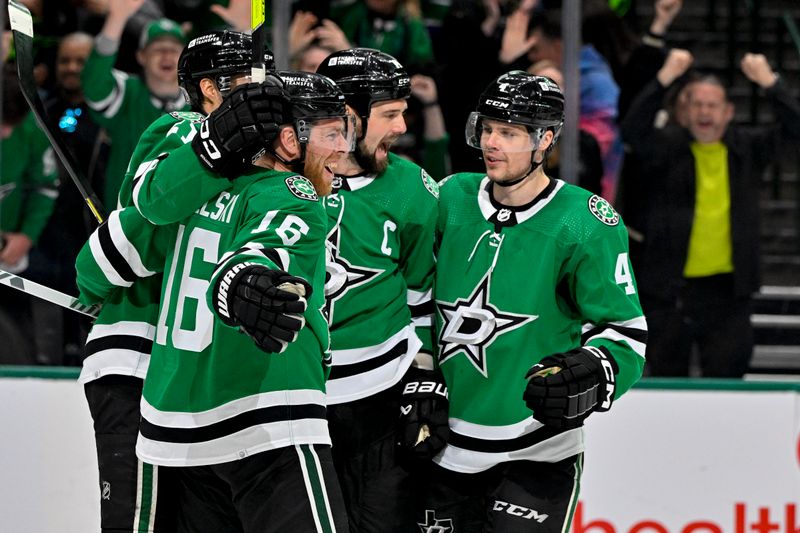 Mar 12, 2024; Dallas, Texas, USA; Dallas Stars left wing Jason Robertson (21) and center Joe Pavelski (16) and left wing Jamie Benn (14) and defenseman Miro Heiskanen (4) celebrates a goal scored by Robertson against the Florida Panthers during the second period at the American Airlines Center. Mandatory Credit: Jerome Miron-USA TODAY Sports