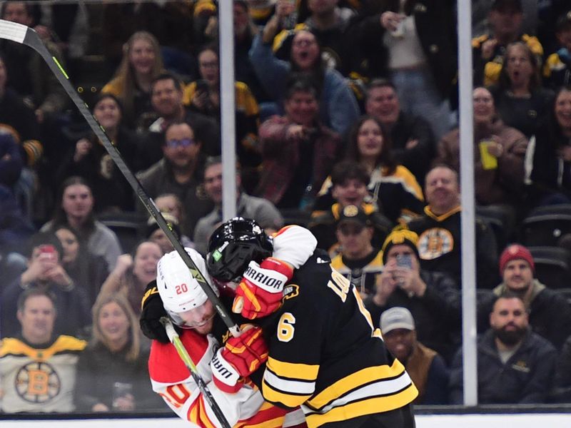 Jan 8, 2026; Boston, Massachusetts, USA; Calgary Flames left wing Blake Coleman (20) and Boston Bruins defenseman Mason Lohrei (6) tussle after a whistle during the first period at TD Garden. Mandatory Credit: Bob DeChiara-Imagn Images