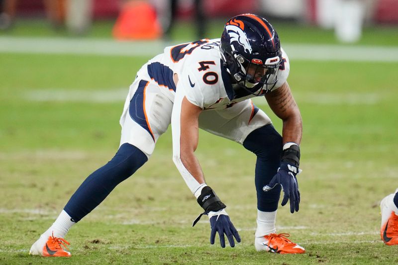 Denver Broncos linebacker Justin Strnad waits for the snap of the ball during the first half of an NFL preseason football game against the Arizona Cardinals, Friday, Aug. 11, 2023, in Glendale, Ariz. (AP Photo/Ross D. Franklin)