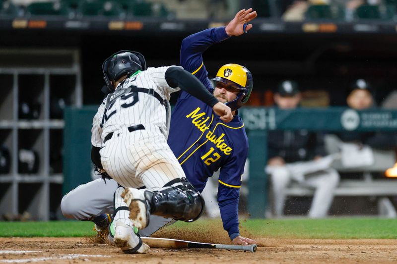 Apr 30, 2025; Chicago, Illinois, USA; Chicago White Sox catcher Matt Thaiss (29) tags out Milwaukee Brewers first baseman Rhys Hoskins (12) at home plate during the eight inning at Rate Field. Mandatory Credit: Kamil Krzaczynski-Imagn Images