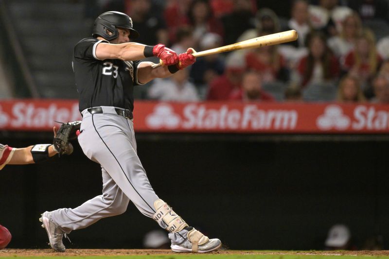 Sep 16, 2024; Anaheim, California, USA;  Chicago White Sox left fielder Andrew Benintendi (23) hits his second home run of the game, a solo shot, in the seventh inning against the Los Angeles Angels at Angel Stadium. Mandatory Credit: Jayne Kamin-Oncea-Imagn Images