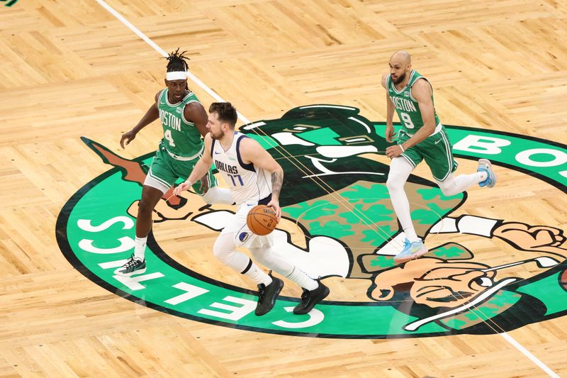 BOSTON, MA - JUNE 17: Luka Doncic #77 of the Dallas Mavericks dribbles the ball during the game against the Boston Celtics during Game 5 of the 2024 NBA Finals on June 17, 2024 at TD Garden in Boston, Massachusetts. NOTE TO USER: User expressly acknowledges and agrees that, by downloading and or using this photograph, User is consenting to the terms and conditions of the Getty Images License Agreement. Mandatory Copyright Notice: Copyright 2024 NBAE  (Photo by Joe Murphy/NBAE via Getty Images)