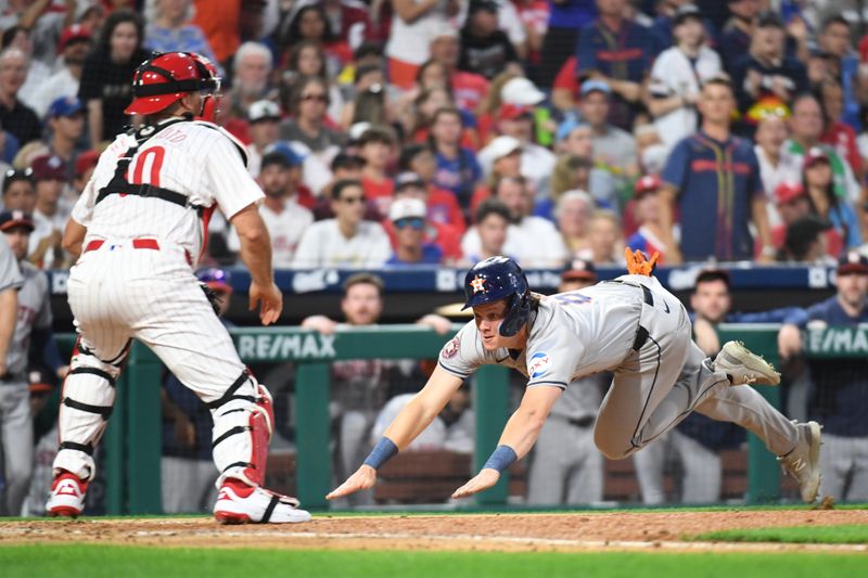 Aug 26, 2024; Philadelphia, Pennsylvania, USA; Houston Astros outfielder Jake Meyers (6) slides safely into home against Philadelphia Phillies catcher J.T. Realmuto (10) during the fourth inning at Citizens Bank Park. Mandatory Credit: Eric Hartline-USA TODAY Sports