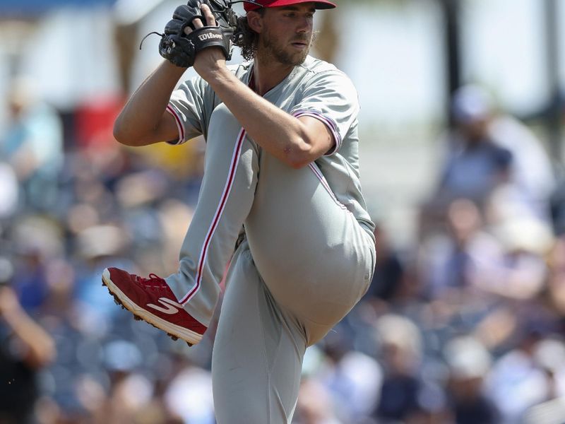 Mar 7, 2024; Port Charlotte, Florida, USA;  Philadelphia Phillies starting pitcher Aaron Nola (27) throws a pitch against the Tampa Bay Rays in the first inning at Charlotte Sports Park. Mandatory Credit: Nathan Ray Seebeck-USA TODAY Sports