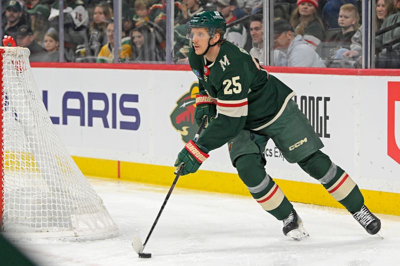 Mar 22, 2025; Saint Paul, Minnesota, USA;  Minnesota Wild defenseman Jonas Brodin (25) controls the puck against the Buffalo Sabres during the first period at Xcel Energy Center. Mandatory Credit: Nick Wosika-Imagn Images