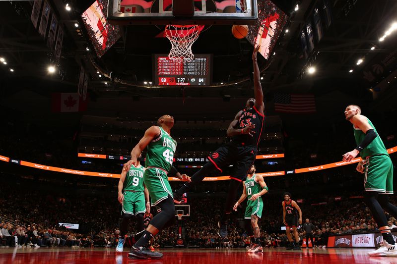 TORONTO, CANADA - JANUARY 15:  Pascal Siakam #43 of the Toronto Raptors drives to the basket during the game against the Boston Celtics on January 15, 2024 at the Scotiabank Arena in Toronto, Ontario, Canada.  NOTE TO USER: User expressly acknowledges and agrees that, by downloading and or using this Photograph, user is consenting to the terms and conditions of the Getty Images License Agreement.  Mandatory Copyright Notice: Copyright 2024 NBAE (Photo by Vaughn Ridley/NBAE via Getty Images)