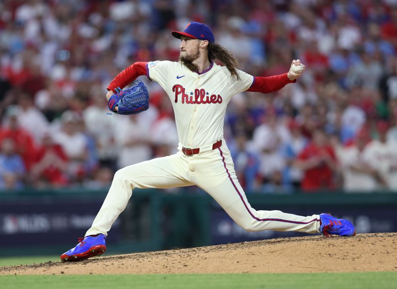 Oct 5, 2024; Philadelphia, PA, USA; Philadelphia Phillies pitcher Matt Strahm (25) throws a pitch against the New York Mets in the eighth inning in game one of the NLDS for the 2024 MLB Playoffs at Citizens Bank Park. Mandatory Credit: Bill Streicher-Imagn Images