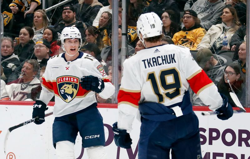 Feb 14, 2024; Pittsburgh, Pennsylvania, USA; Florida Panthers center Anton Lundell (15) reacts after scoring a goal as left wing Matthew Tkachuk (19) celebrates against the Pittsburgh Penguins during the second period at PPG Paints Arena. Florida won 5-2.Mandatory Credit: Charles LeClaire-USA TODAY Sports