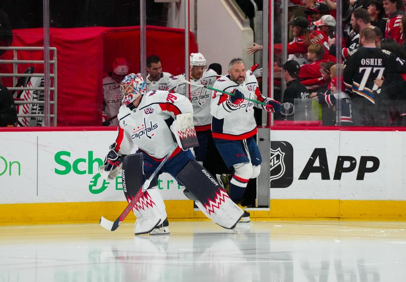 Nov 3, 2024; Raleigh, North Carolina, USA;  Washington Capitals goaltender Charlie Lindgren (79) and left wing Alex Ovechkin (8) come out onto the ice for the warmups against the Carolina Hurricanes at Lenovo Center. Mandatory Credit: James Guillory-Imagn Images