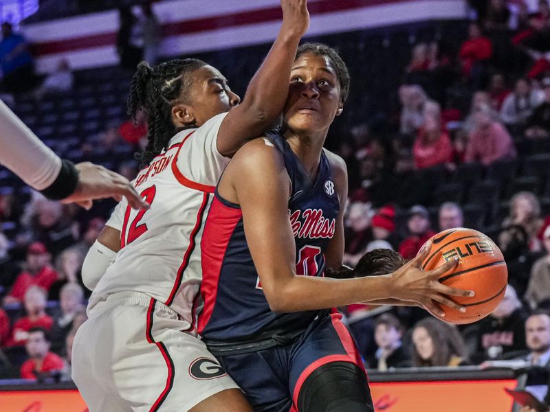 Jan 21, 2024; Athens, Georgia, USA; Ole Miss Rebels guard Ayanna Thompson (20) drives to the basket against Georgia Bulldogs guard Taniyah Thompson (12) at Stegeman Coliseum. Mandatory Credit: Dale Zanine-USA TODAY Sports