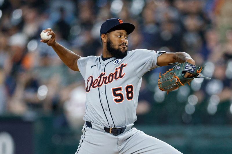 Jun 2, 2025; Chicago, Illinois, USA; Detroit Tigers relief pitcher Dylan Smith (58) delivers a pitch against the Chicago White Sox during the seventh inning at Rate Field. Mandatory Credit: Kamil Krzaczynski-Imagn Images