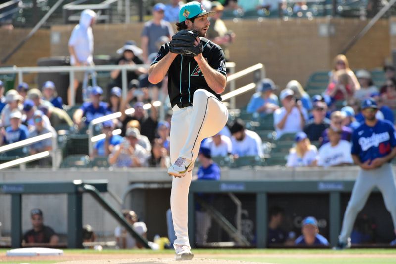 Feb 25, 2026; Salt River Pima-Maricopa, Arizona, USA; Arizona Diamondbacks pitcher Zac Gallen (23) throws in the first inning against the Los Angeles Dodgers at Salt River Fields at Talking Stick. Mandatory Credit: Matt Kartozian-Imagn Images