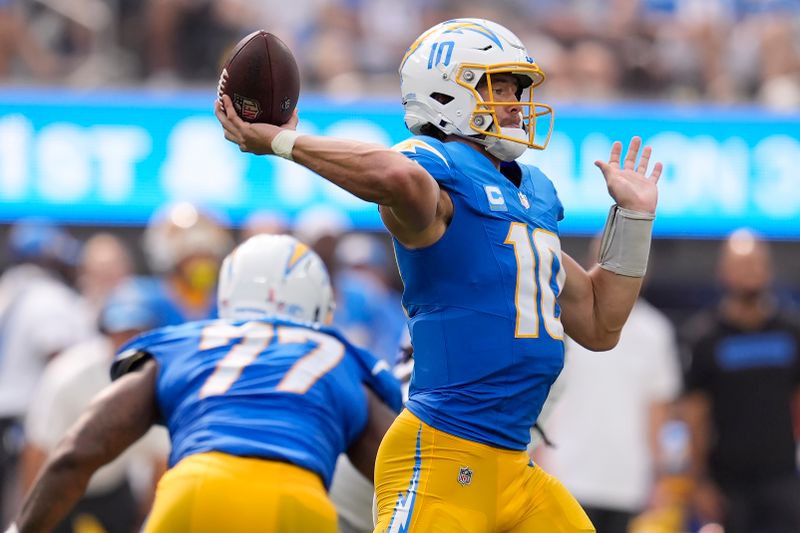 Los Angeles Chargers quarterback Justin Herbert (10) passes against the Las Vegas Raiders during the second half of an NFL football game, Sunday, Sept. 8, 2024, in Inglewood, Calif. (AP Photo/Marcio Jose Sanchez)