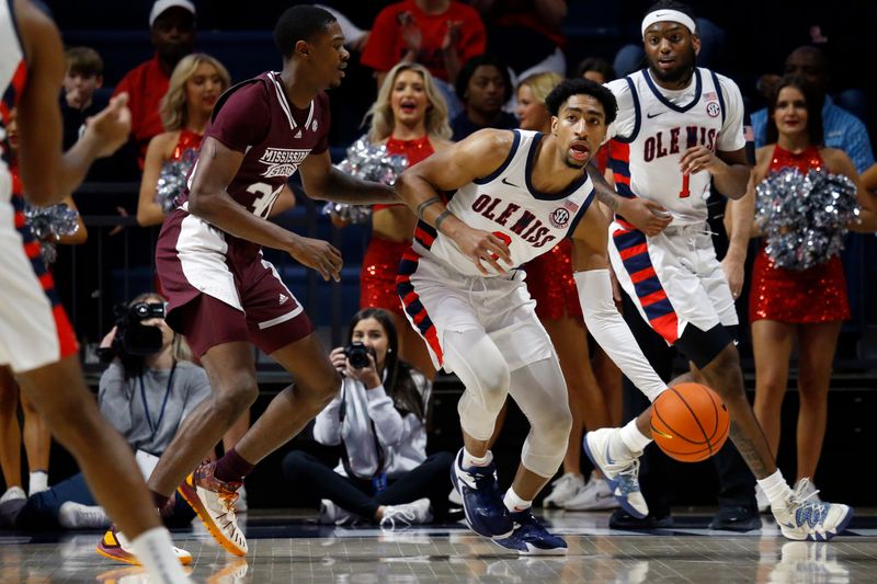 Feb 18, 2023; Oxford, Mississippi, USA; Mississippi Rebels forward Myles Burns (3) passes the ball as Mississippi State Bulldogs guard Shawn Jones Jr. (30) defends during the first half at The Sandy and John Black Pavilion at Ole Miss. Mandatory Credit: Petre Thomas-USA TODAY Sports