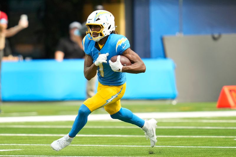 Los Angeles Chargers wide receiver Quentin Johnston (1) runs against the Las Vegas Raiders during the second half of an NFL football game, Sunday, Sept. 8, 2024, in Inglewood, Calif. (AP Photo/Ashley Landis)