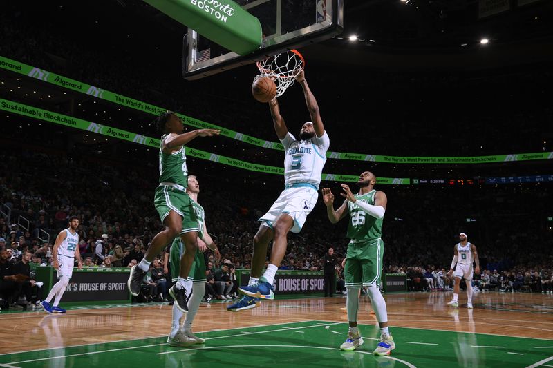 BOSTON, MA - APRIL 12: Marques Bolden #3 of the Charlotte Hornets dunks the ball during the game against the Boston Celtics on April 12, 2024 at the TD Garden in Boston, Massachusetts. NOTE TO USER: User expressly acknowledges and agrees that, by downloading and or using this photograph, User is consenting to the terms and conditions of the Getty Images License Agreement. Mandatory Copyright Notice: Copyright 2024 NBAE  (Photo by Brian Babineau/NBAE via Getty Images)