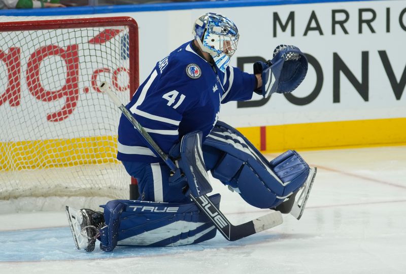 Nov 8, 2024; Toronto, Ontario, CAN; Toronto Maple Leafs goaltender Anthony Stolarz (41) makes a save during warm up before a game against the Detroit Red Wings at Scotiabank Arena. Mandatory Credit: John E. Sokolowski-Imagn Images