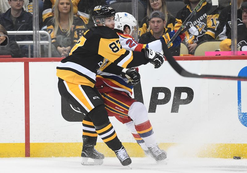 Dec 30, 2022; Pittsburgh, Pennsylvania, USA; Pittsburgh Penguins center Sidney Crosby (87) gets tangled up with New Jersey Devils defenseman Damon Severson (28) during the third period at PPG Paints Arena. Mandatory Credit: Philip G. Pavely-USA TODAY Sports