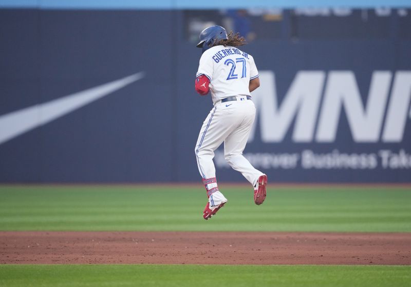 Jun 29, 2023; Toronto, Ontario, CAN; Toronto Blue Jays designated hitter Vladimir Guerrero Jr. (27) runs the bases after hitting a two run home run against the San Francisco Giants during the sixth inning at Rogers Centre. Mandatory Credit: Nick Turchiaro-USA TODAY Sports